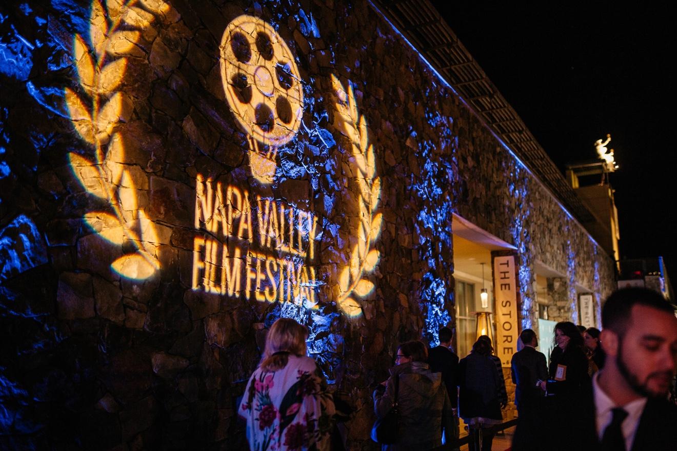 Napa Valley Film Festival event projected across a stone venue at night