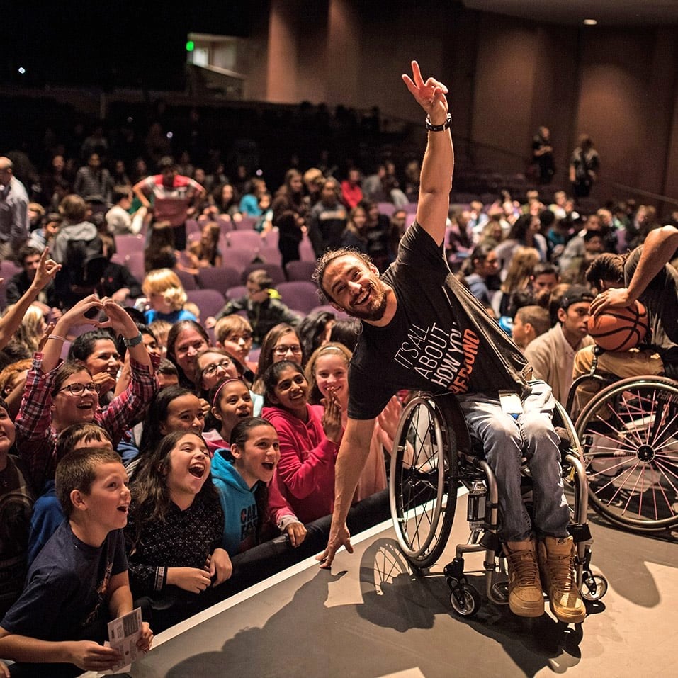 Inclusive youth audience celebrating a creative event
